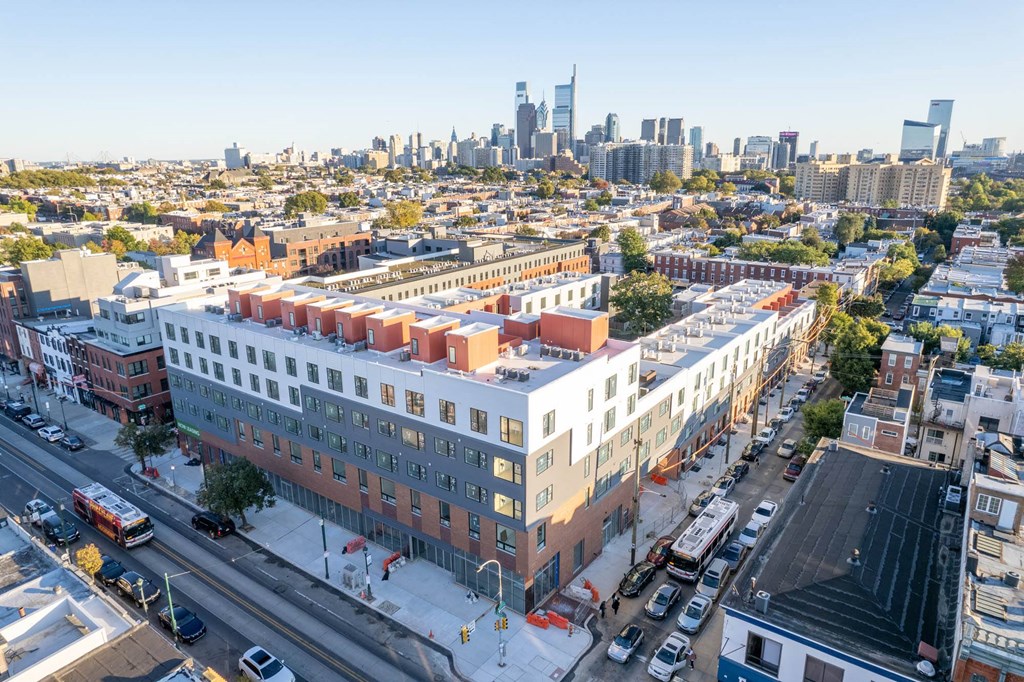 an aerial view of the block of apartments and the city skyline
