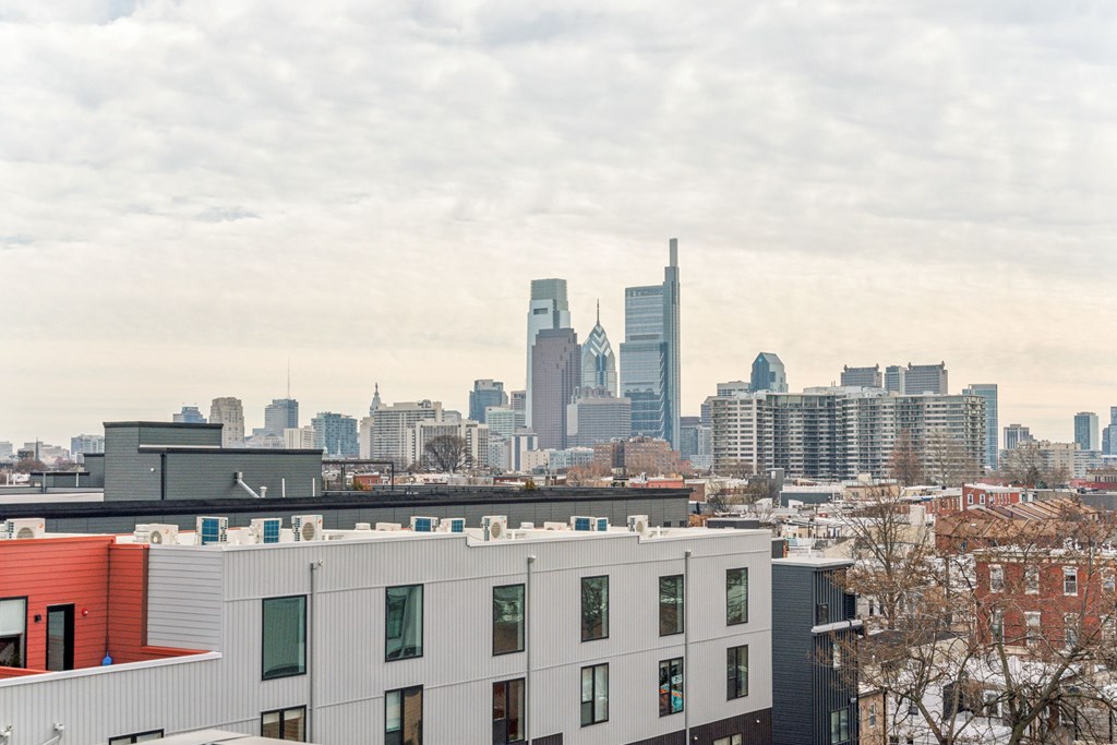 A cityscape with a mix of modern and older buildings.
