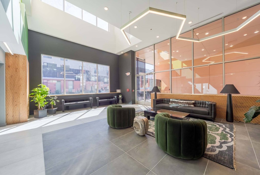 A modern waiting area with a large window and comfortable seating.