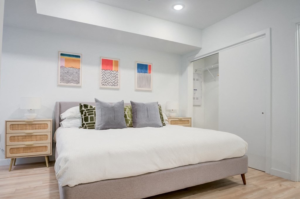 a bedroom with a bed and a closet