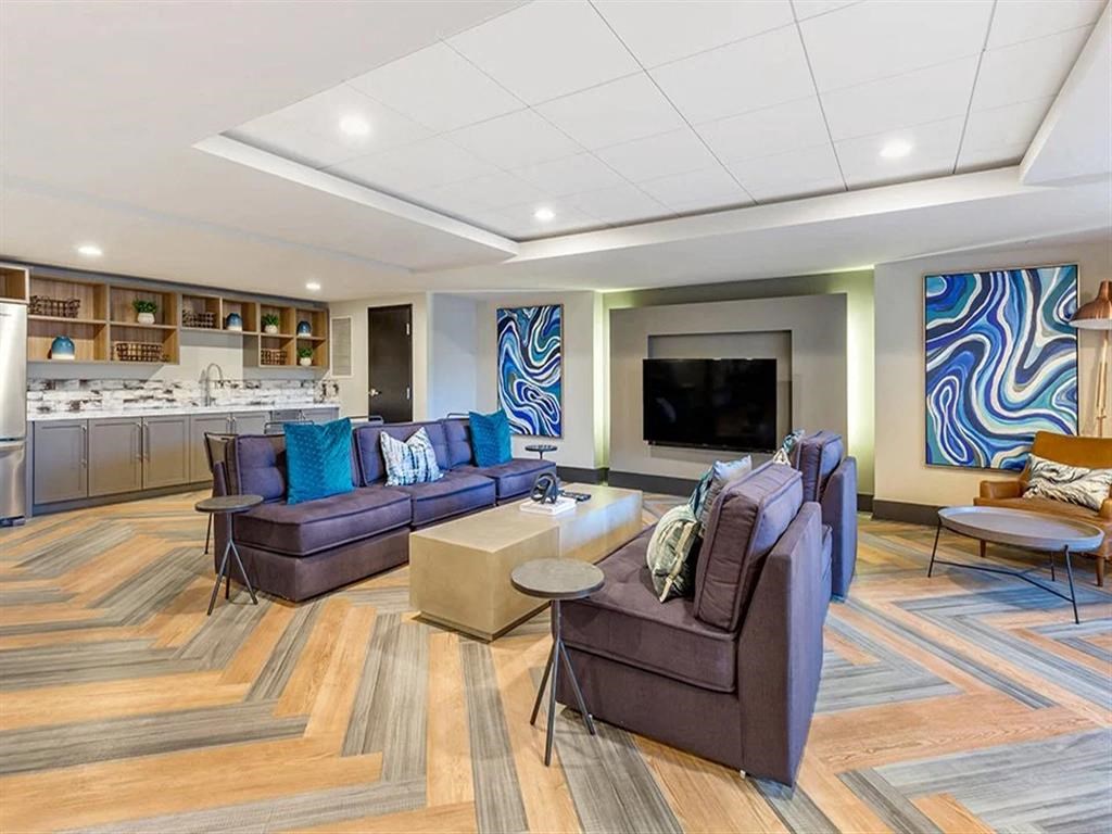 a living room with couches and a television