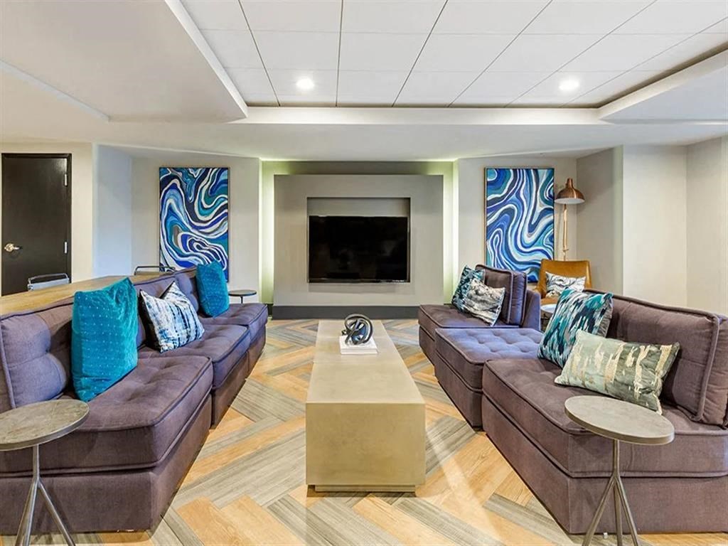 a living room with couches and a television