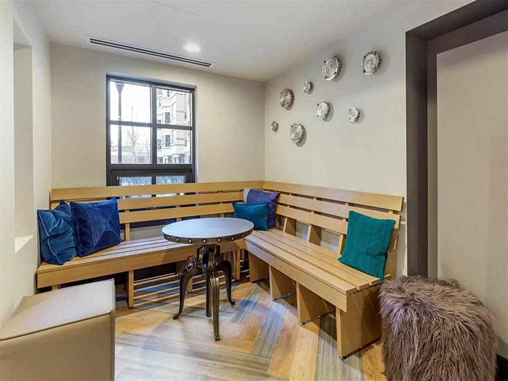a dining room with a wooden bench and a table
