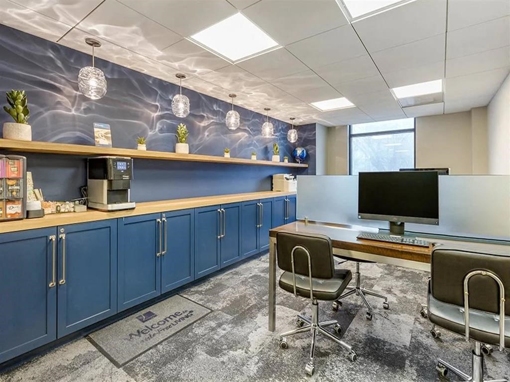 a desk and a computer in a room