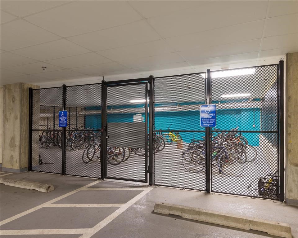 a group of bikes parked in a parking garage