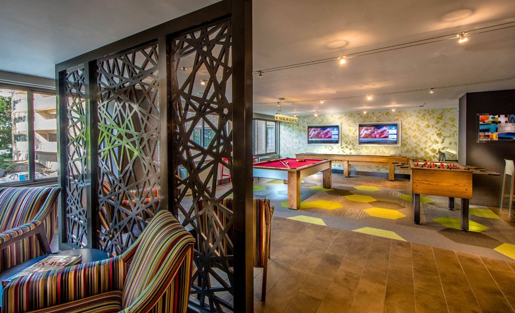 a games room with a pool table and a billiard table