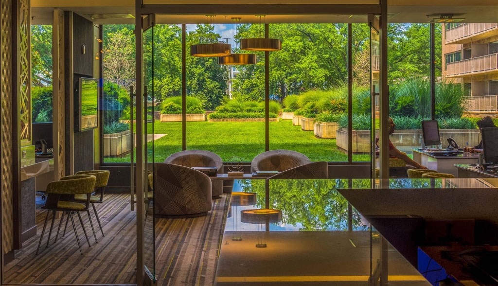 a restaurant or other place to eat in a room with large glass windows