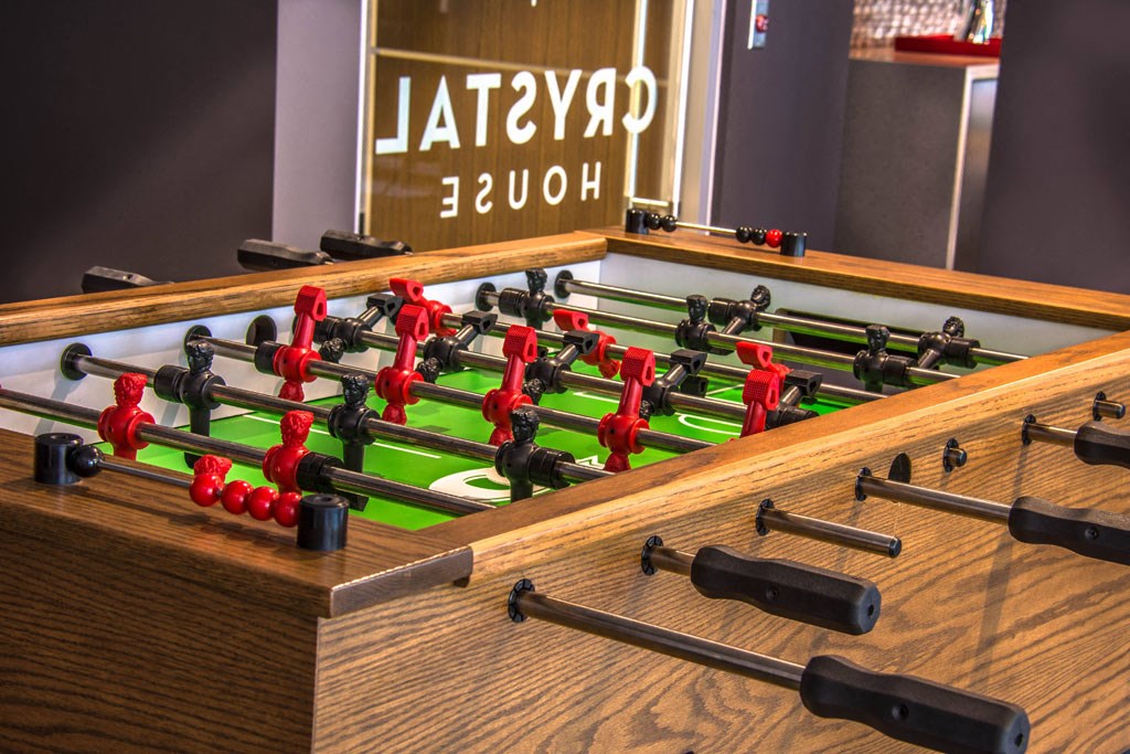 a game of foosball on a table in a room