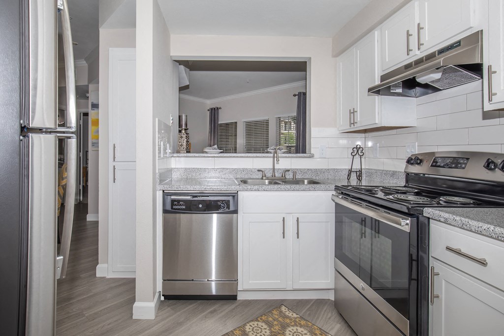 Apartments In Houston Texas for Rent – Westchase Forest - Photo of a kitchen with stainless steel appliances and white cabinets