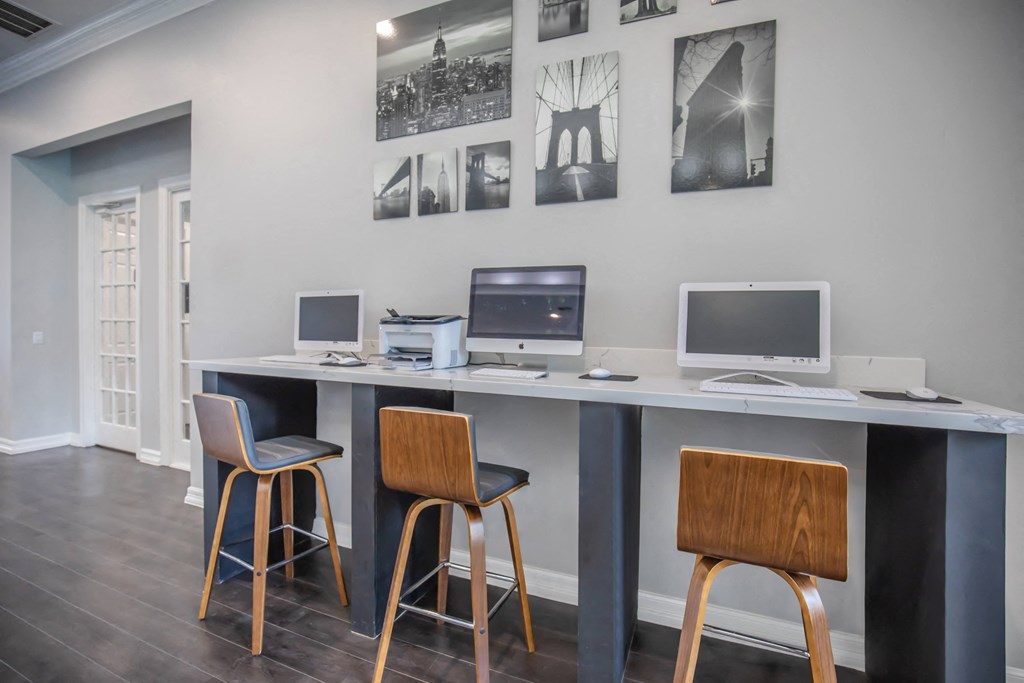 Apartments In Houston Texas for Rent – Westchase Forest - Photo of a long desk with three computers and three stools