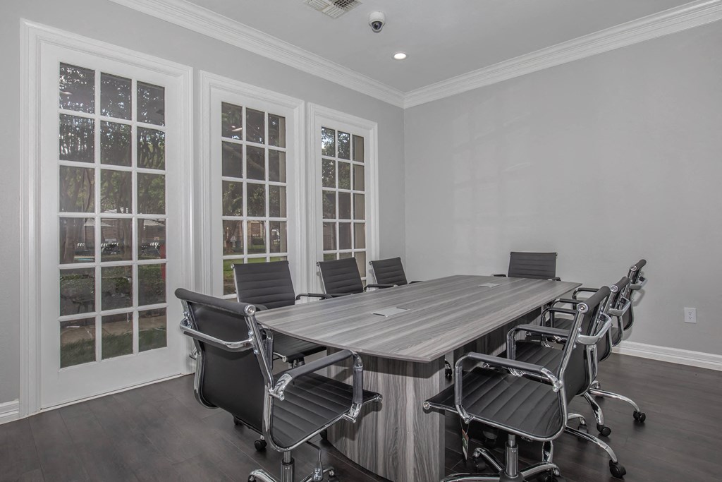 a room filled with rows of chairs in front of windows