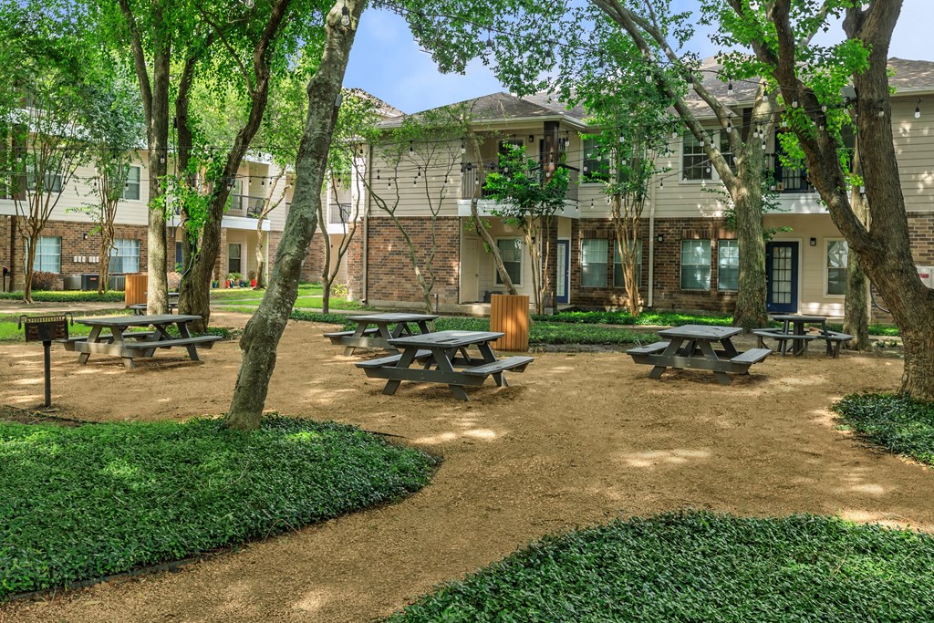 Pet-Friendly Apartments in Houston, TX – Westchase Forest – Photo of our apartments have a spacious courtyard with picnic tables