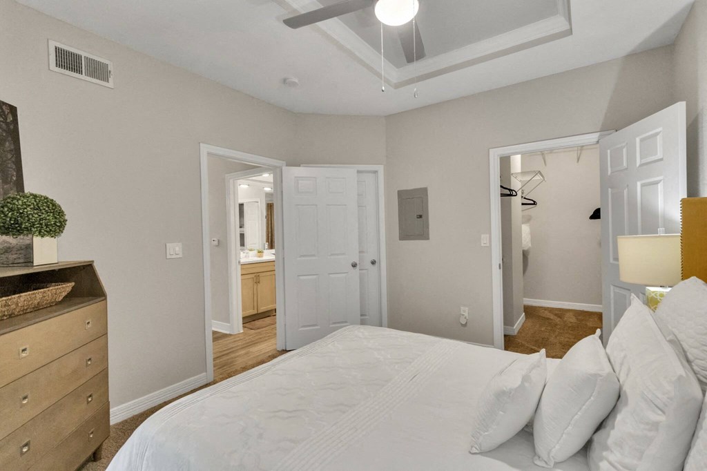Apartments near Alief Texas for Rent – Gramercy Park - Photo of a bedroom with a large bed and a closet