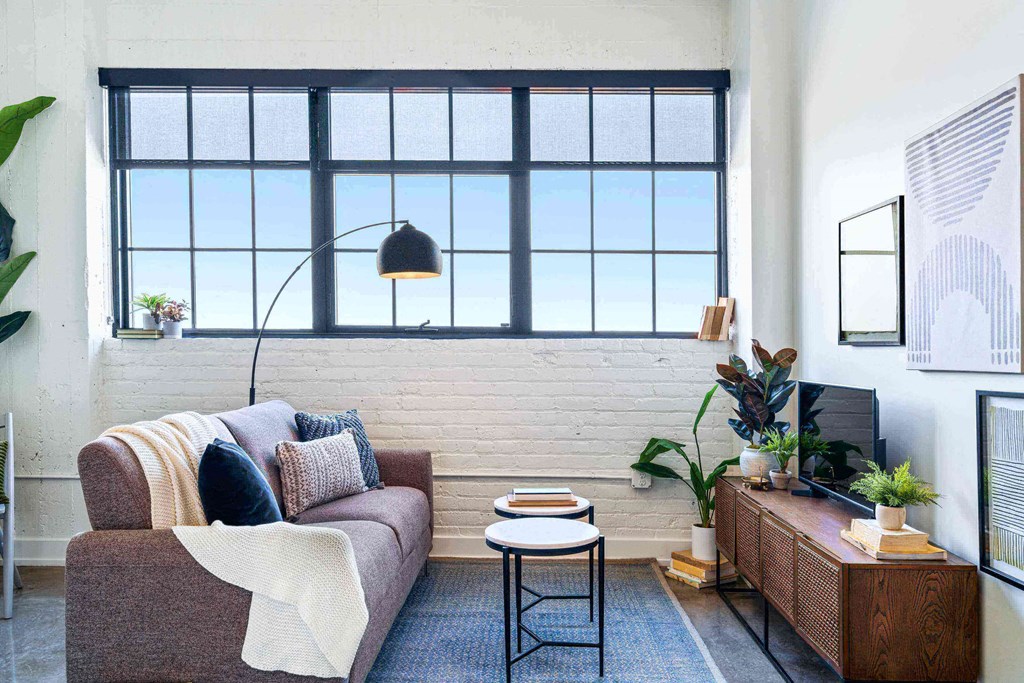 a living room with a couch and a window