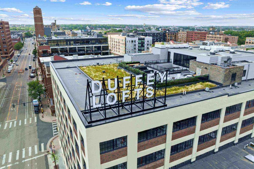 an aerial view of a building with a green roof