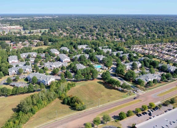 A suburban neighborhood with houses and trees.