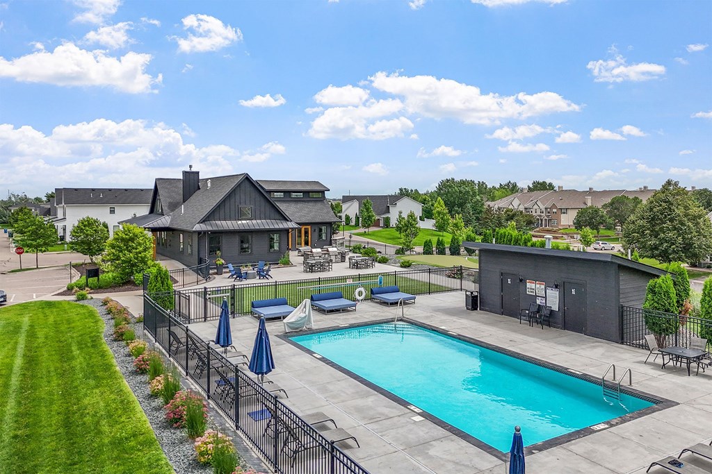 A large house with a pool in the backyard.