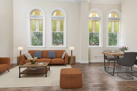 A living room with a brown sofa and a coffee table.
