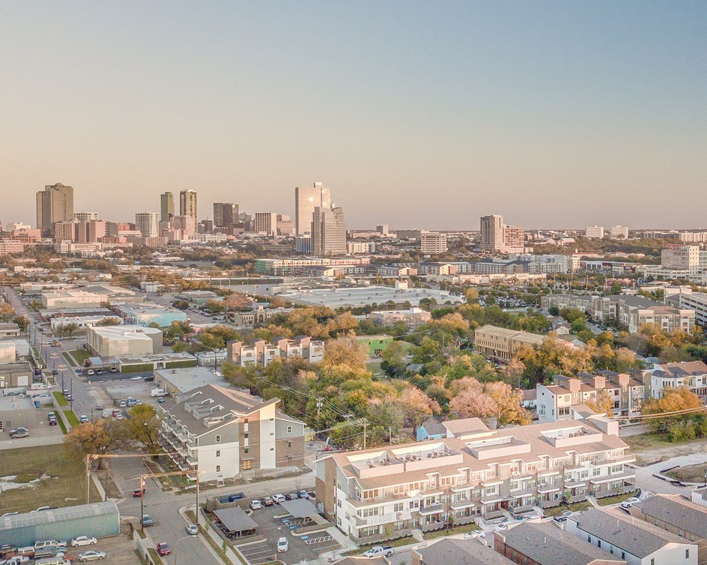 an aerial view of the city with the skyline in the background