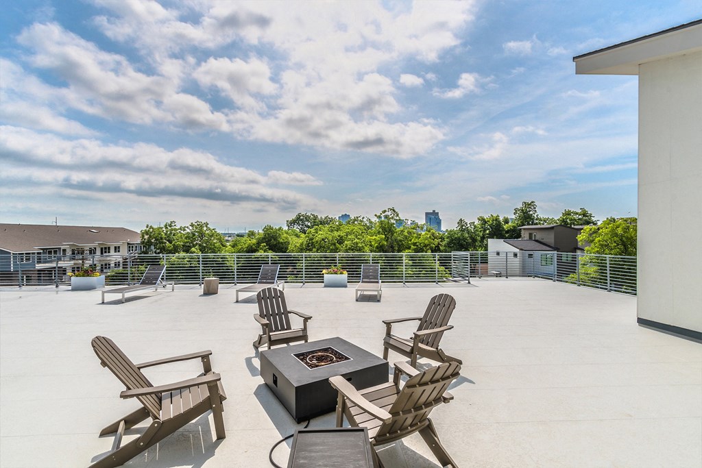 the preserve at ballantyne commons rooftop patio with chairs and a fire pit