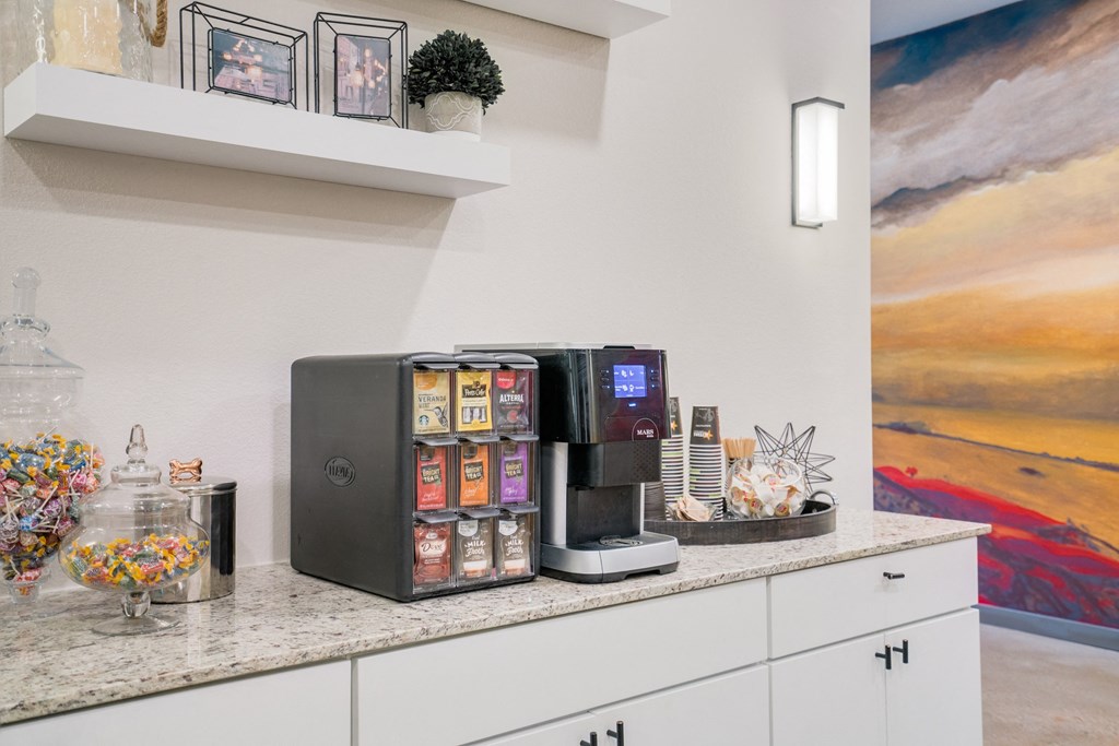 a coffee maker sitting on a counter in a kitchen