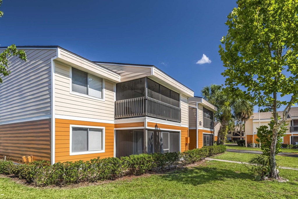 Apartments in Kissimmee for Rent - Mirador at Woodside - Outside of Apartment Buildings with Beautiful Landscaping
