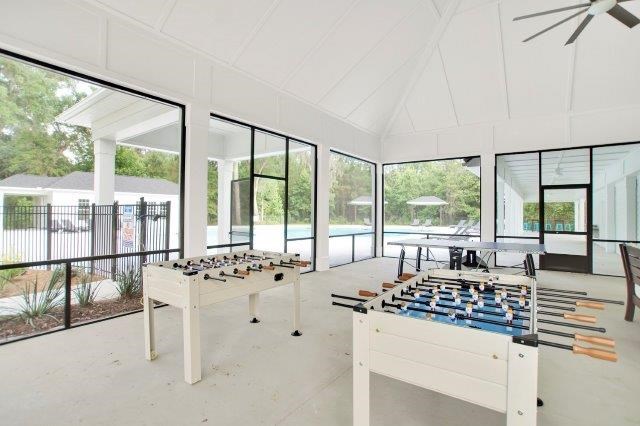 Omnia at Richmond Hill Townhomes in Georgia photo of a large room with a foosball table and games
