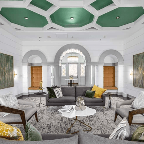 A living room with a grey couch and a coffee table.
