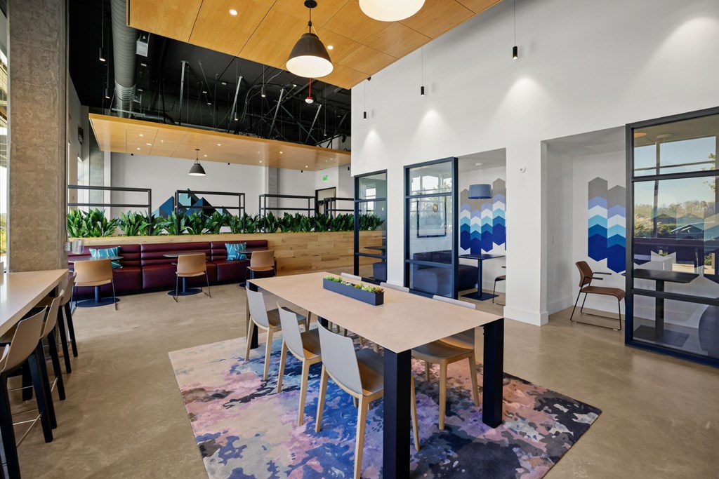 a dining room with a table and chairs