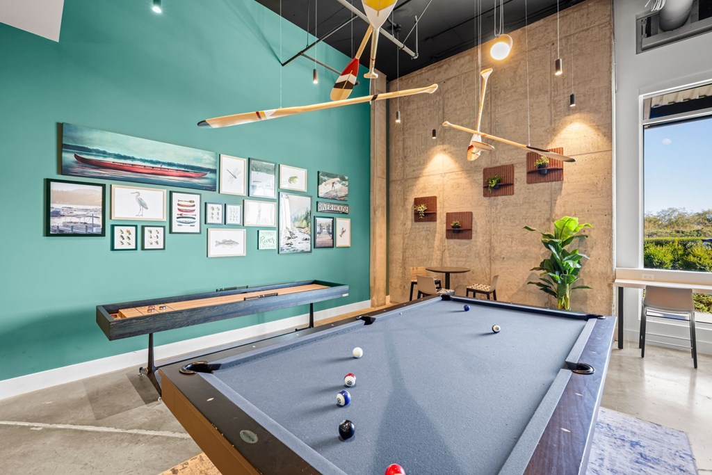 a pool table in a game room with a view