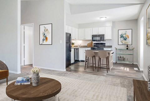 A modern kitchen with a dining table and chairs.