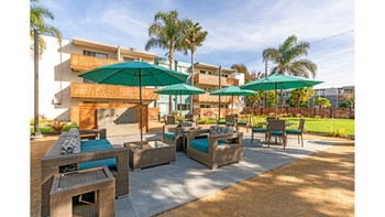 Alameda Apartments-Rica Vista Sparkling Swimming Pool Surrounded by Shaded Seating and Grills - Photo Gallery 2