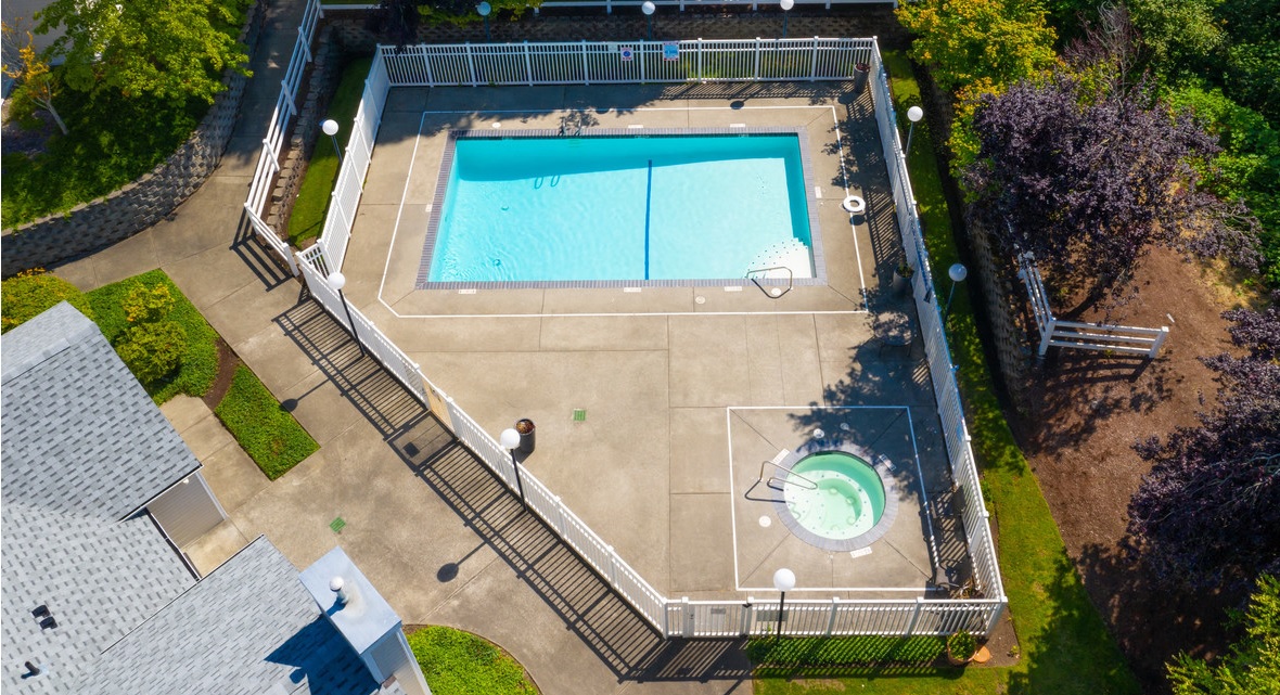 Apartments in Lacey WA - The Village at Union Mills - Aerial View of Pool and Hot Tub in Gated Enclosure