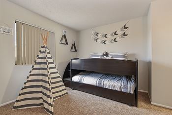 a bedroom with a bed and a tent