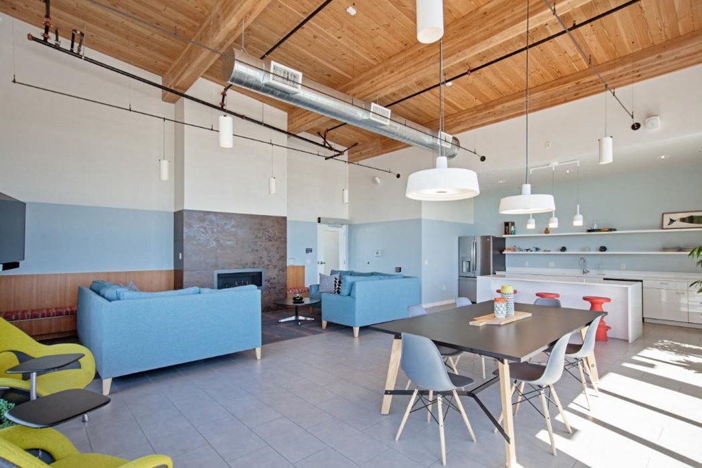 a living room with a table chairs and a couch