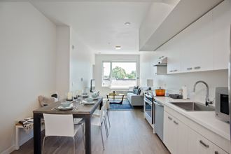 a kitchen and living room in a 555 waverly unit