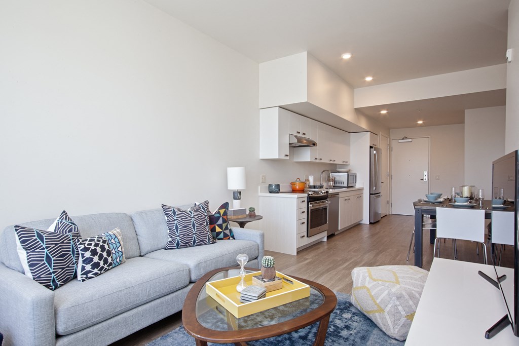 Apartments in Beaverton for Rent - Westline - Open Concept Living Room with Wood-Style Flooring and Attached Kitchen & Dining Area