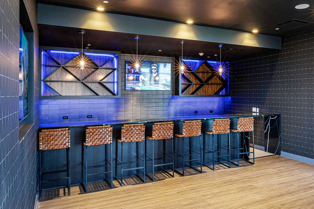 3thirty3 new rochelle ny apartment high rise photo of sports pub area with bar seating and multiple televisions TVs and modern furniture and lighting