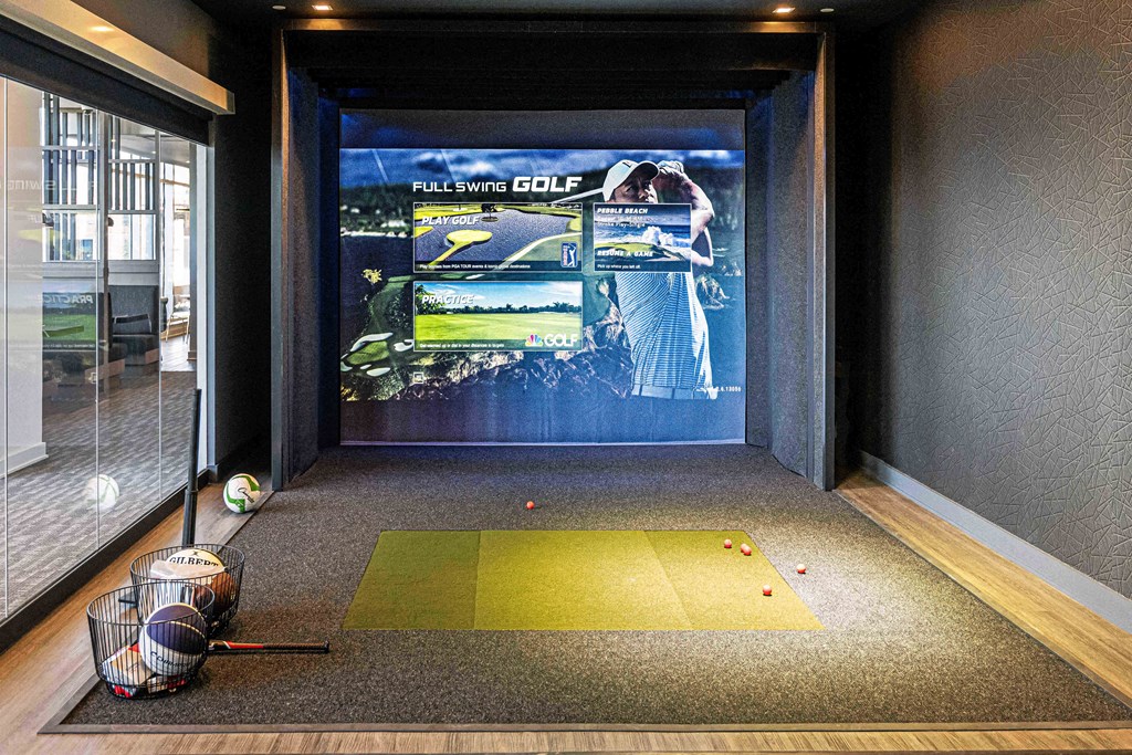 3thirty3 new rochelle ny apartment high rise photo of sports simulator with golf clubs and golf balls as well as other sports equipment