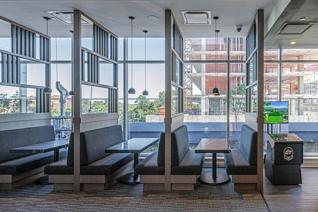 3thirty3 new rochelle ny apartment high rise photo of co-working area with multiple booths and tables for working and conferences