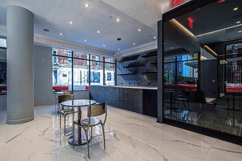 3thirty3 new rochelle ny apartment high rise photo of amenity area with pub seating and marble flooring