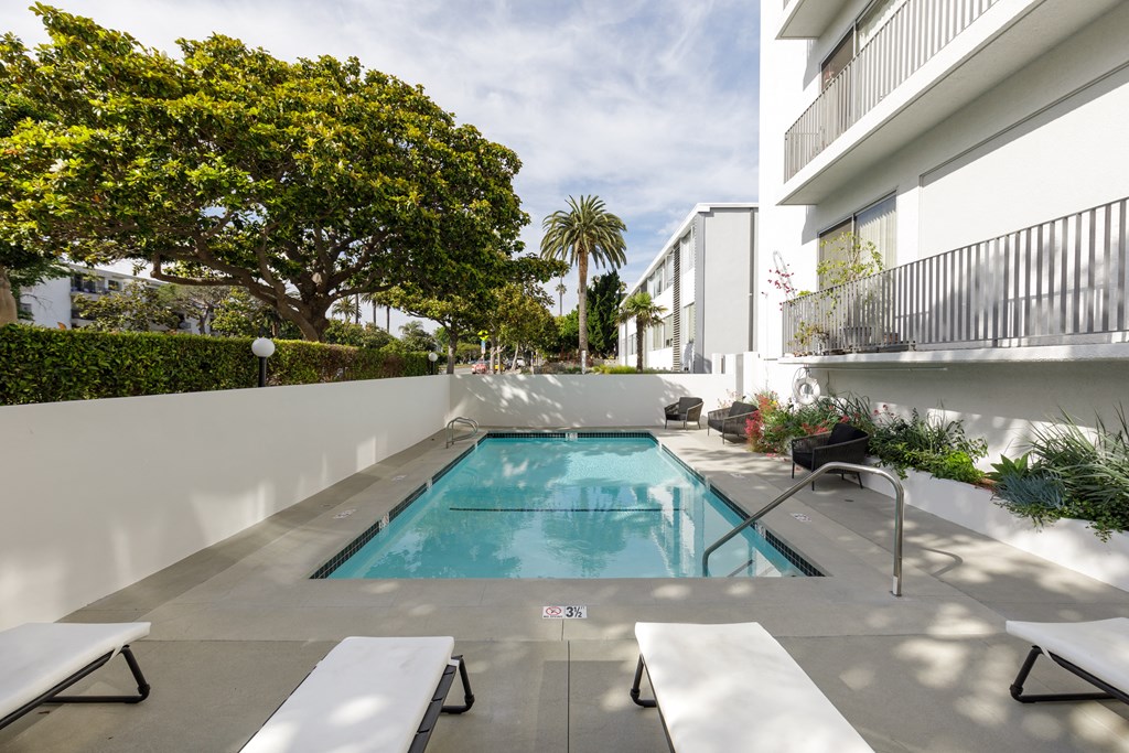 Apartments Santa Monica, CA - San Vicente Tower - Swimming Pool with Lounge Chairs and Landscaping