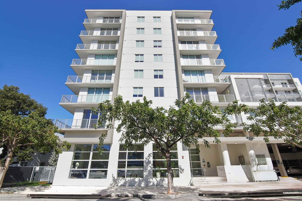 Pet-Friendly Rentals in Miami River, FL – Riverview One Apartments – A photo of our exterior of the building with trees in front