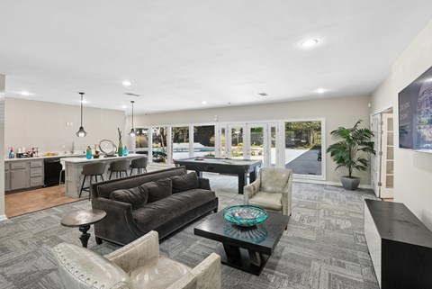 A living room with a grey couch and a coffee table.