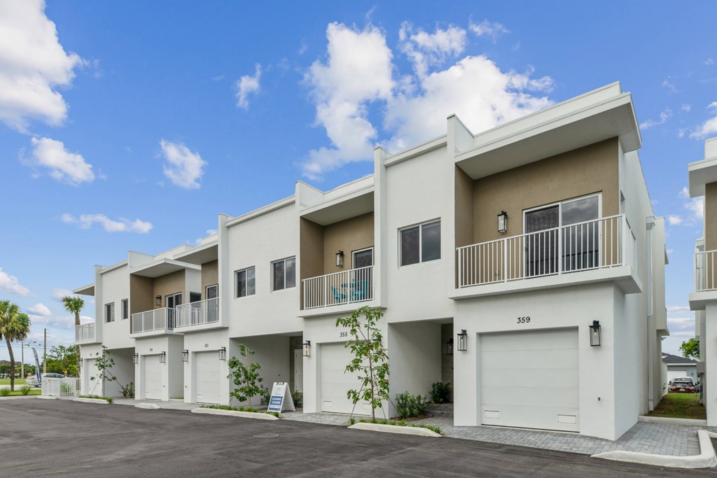 Pearl at Pompano Beach Townhomes in Pompano Beach, FL outside of townhomes with garages