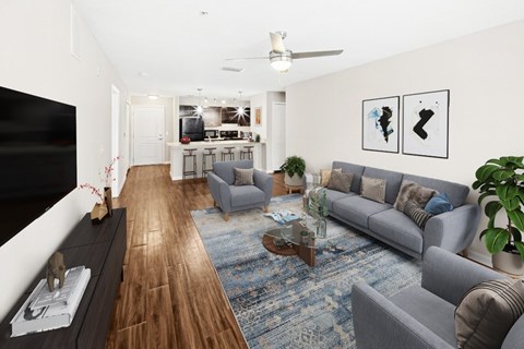 A living room with a grey couch and a coffee table.