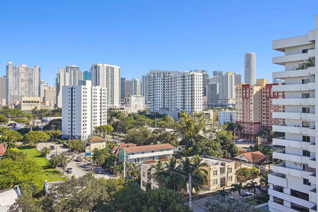 1- & 2-Bedroom Apartments for Rent in Miami, FL – Riverview One Apartments – A cityscape with a mix of modern and older buildings in Miami, FL