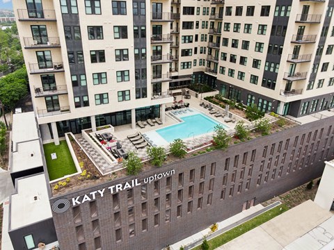 A large building with a pool in the middle of it.