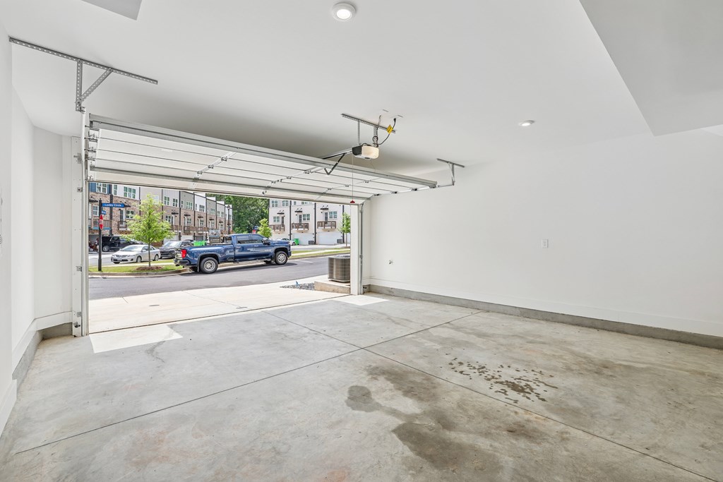 A large empty room with a view of the street outside.