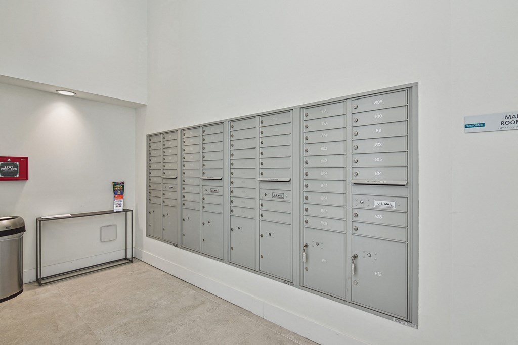 1- & 2-Bedroom Apartments for Rent in Miami, FL – Riverview One Apartments – A row of mailboxes are lined up against a wall.